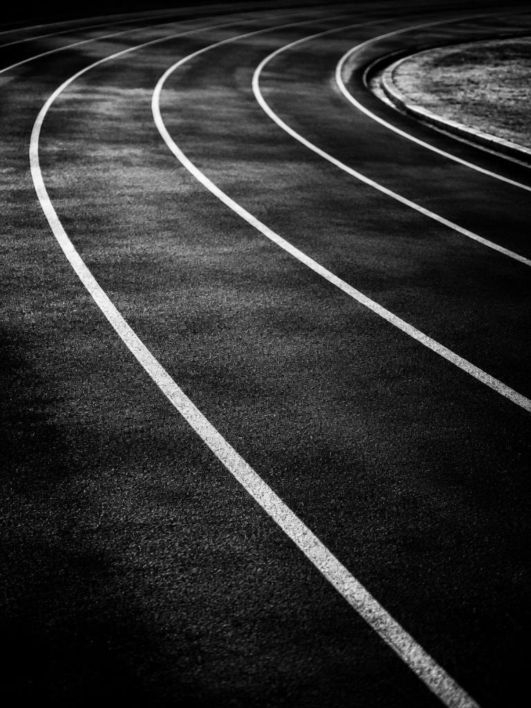 Running track lanes marked with white lines