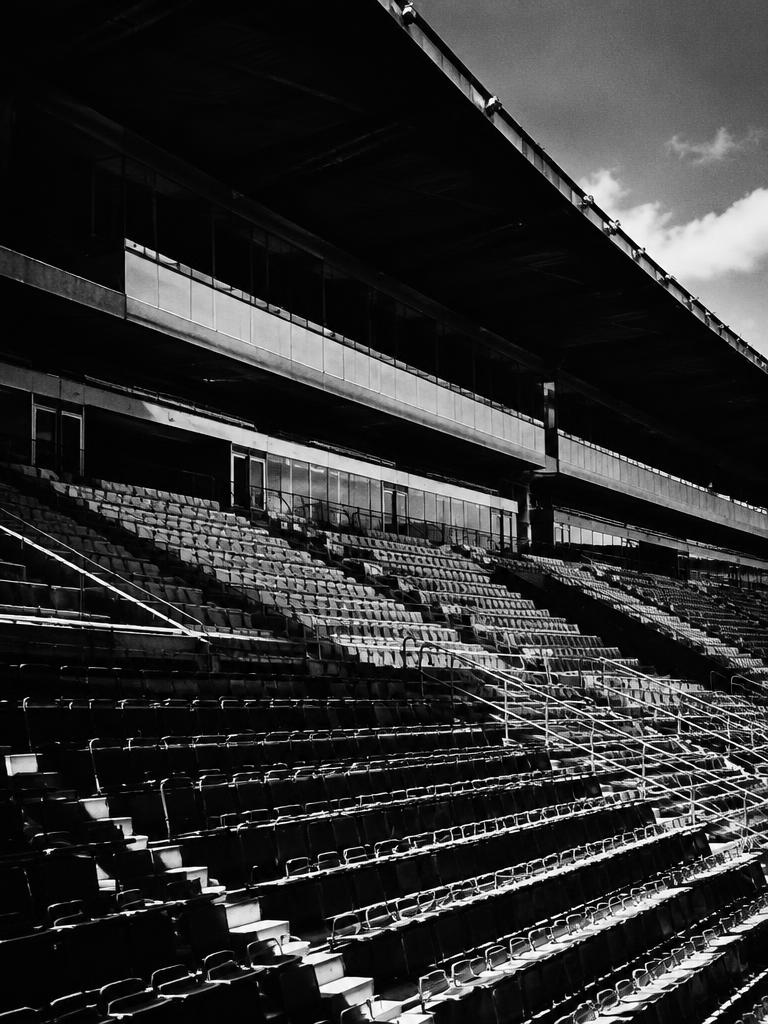 Empty stadium seating rising in tiers